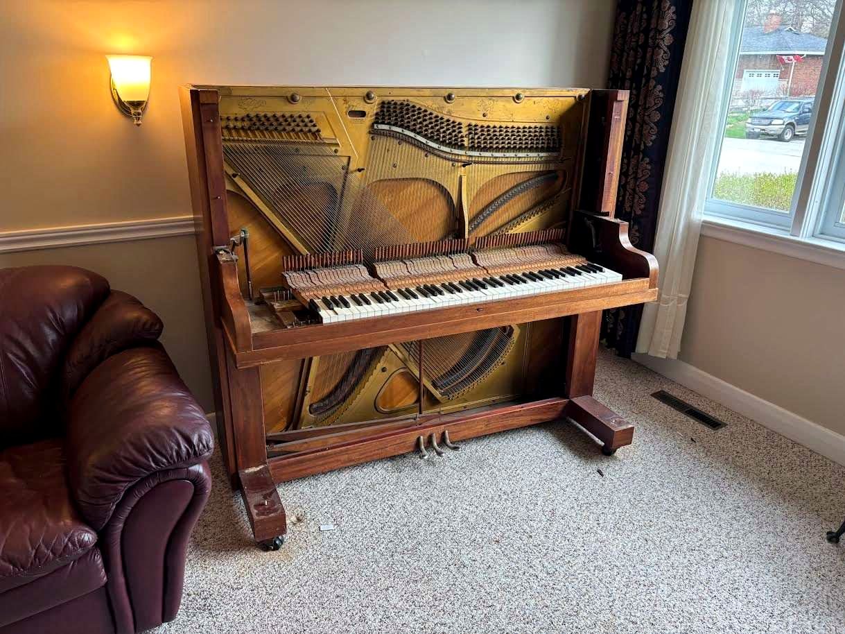 Piano being moved by the All Clear crew